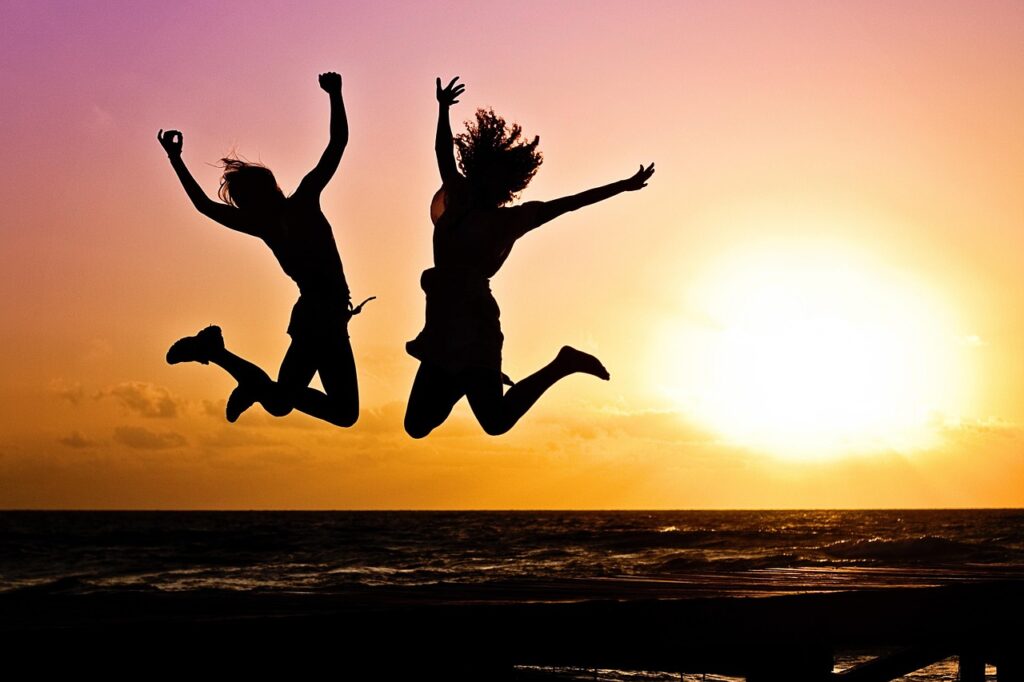 new year background, sunset, nature, beach, silhouettes, jump, jumping, youth, active, happy, pair, girls, young women, people, joy, freedom, seaside, dusk
